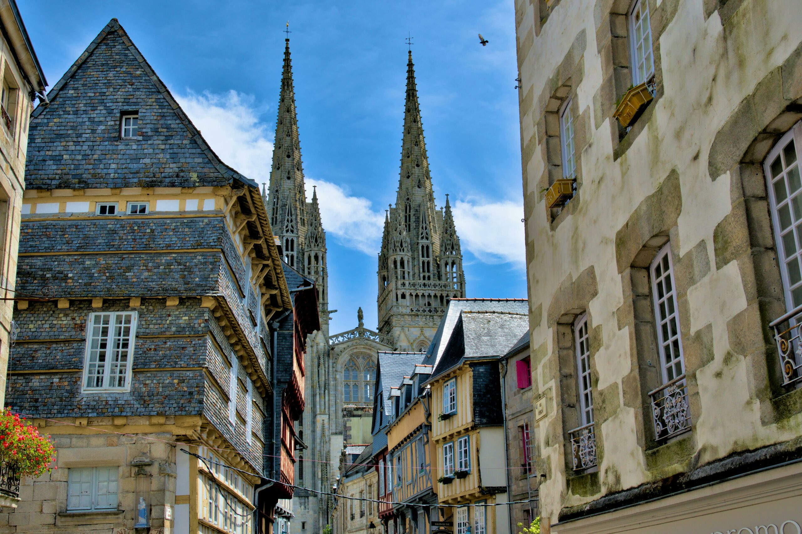 A picturesque view of Saint Corentin Cathedral in Quimper, France, showcasing Gothic architecture.